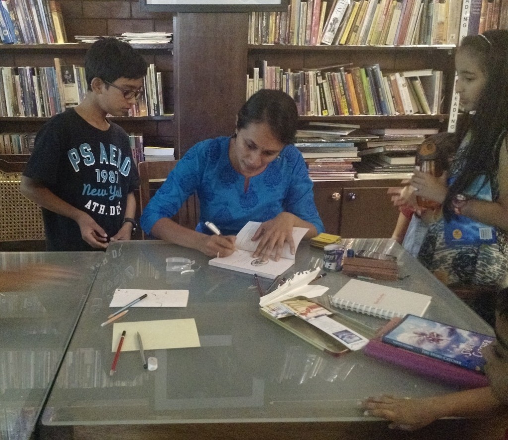 Signing copies of The Story-Catcher at Atta Galatta