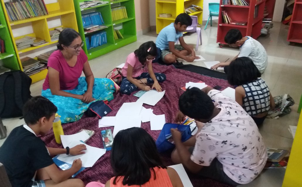 Children writing during a workshop