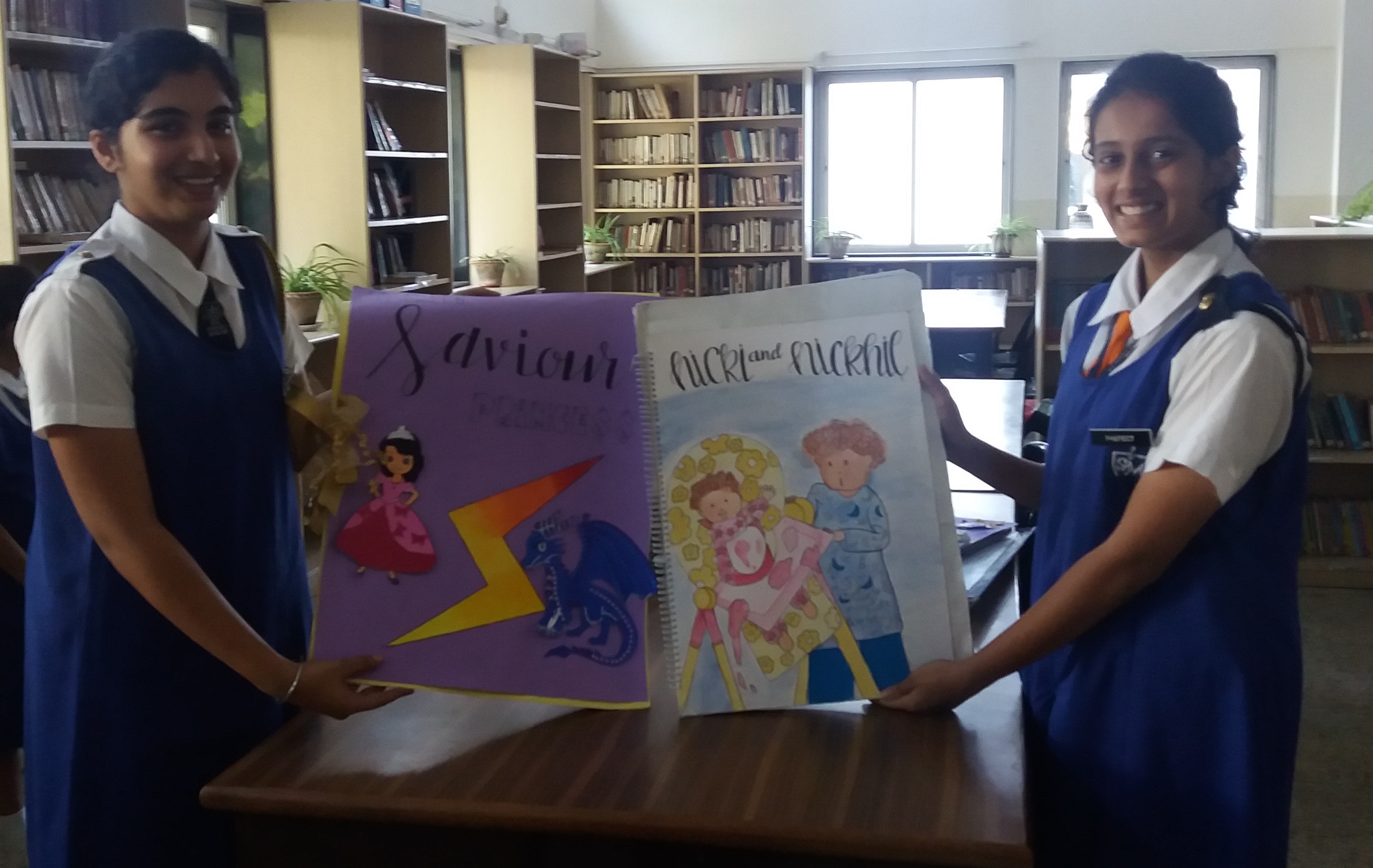 Two girls with the books they made