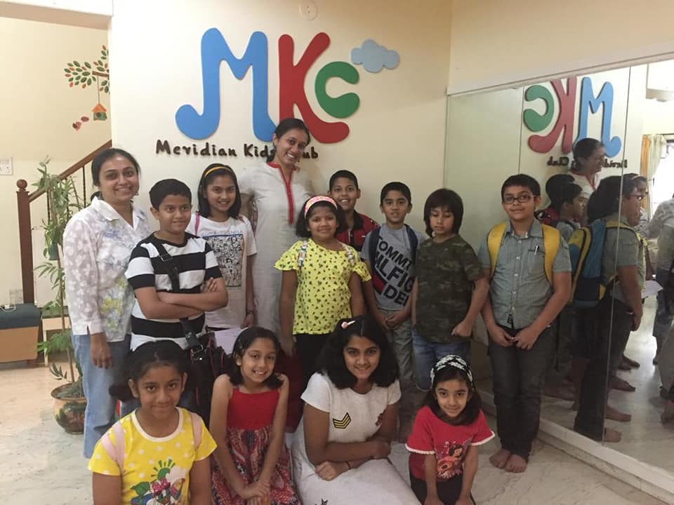 Varsha Seshan with children at Meridian Kids Club