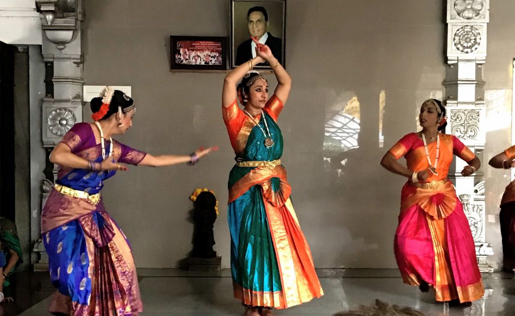 Three dancers in Bharatanatyam costume, denoting the churning of the ocean