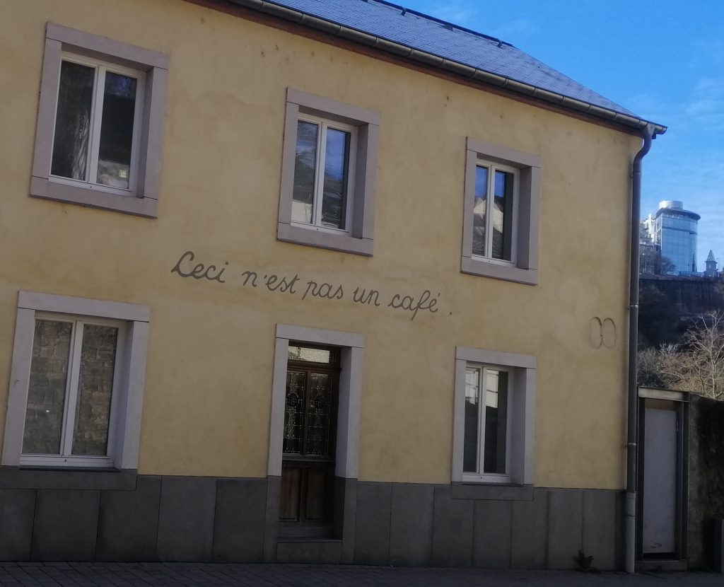 A building which says 'Ceci n'est pas un cafe.