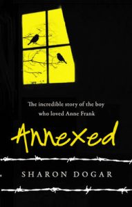 Book cover
Text: The incredible story of the boy who loved Anne Frank
Annexed
Sharon Dogar
Image: Two silhouetted birds on a bare tree visible through a window. Everything else is black, with barbed wire highlighting the writer's name.