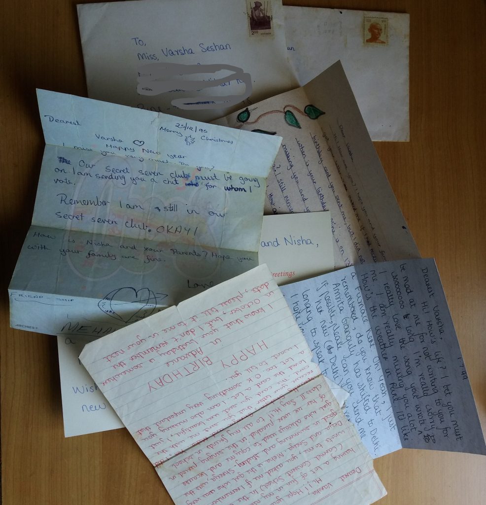 A pile of letters on two stamped envelopes