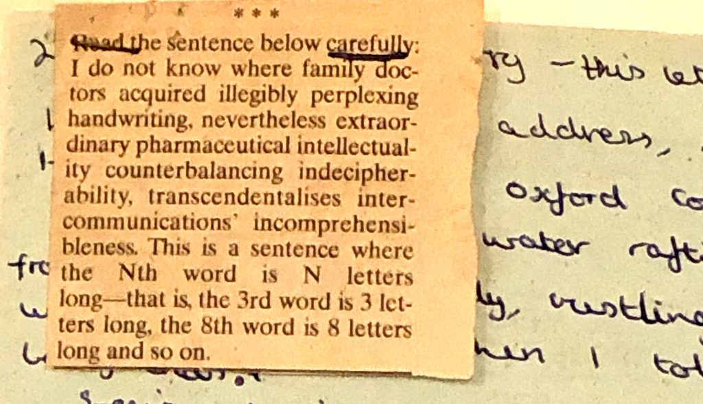 A square clipping from a newspaper stapled to part of a handwritten letter