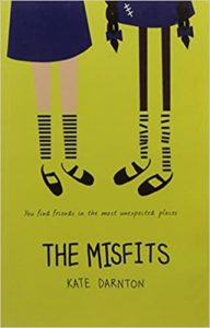 Book cover
Text: You find friends in the most unexpected places
The Misfits
Kate Darnton
Image: Illustration of the lower half of two schoolgirls in uniform . One child's legs are white and her uniform and socks are neat. The other is brown her uniform is mended, her socks are crooked.