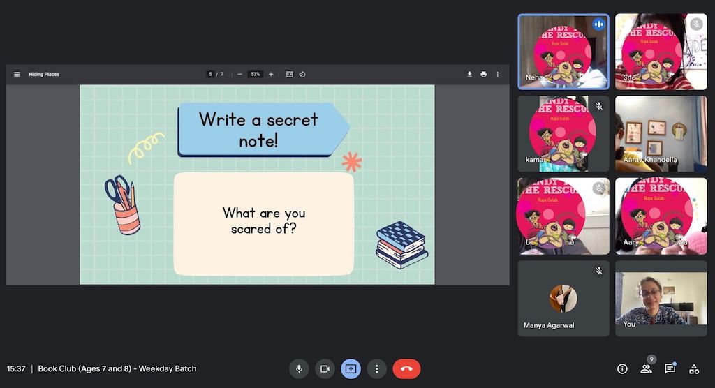 Screenshot of a class (faces hidden) with a presentation that reads:
Write a secret note!
What are you scared of?
