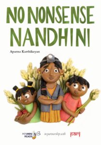 Book cover
Text: No Nonsense Nandhini
Aparna Karthikeyan
Text: A woman wearing a torch on her forehead, a boy with tuberoses on one side and a girl with a basket on the other. Tuberoses in the background