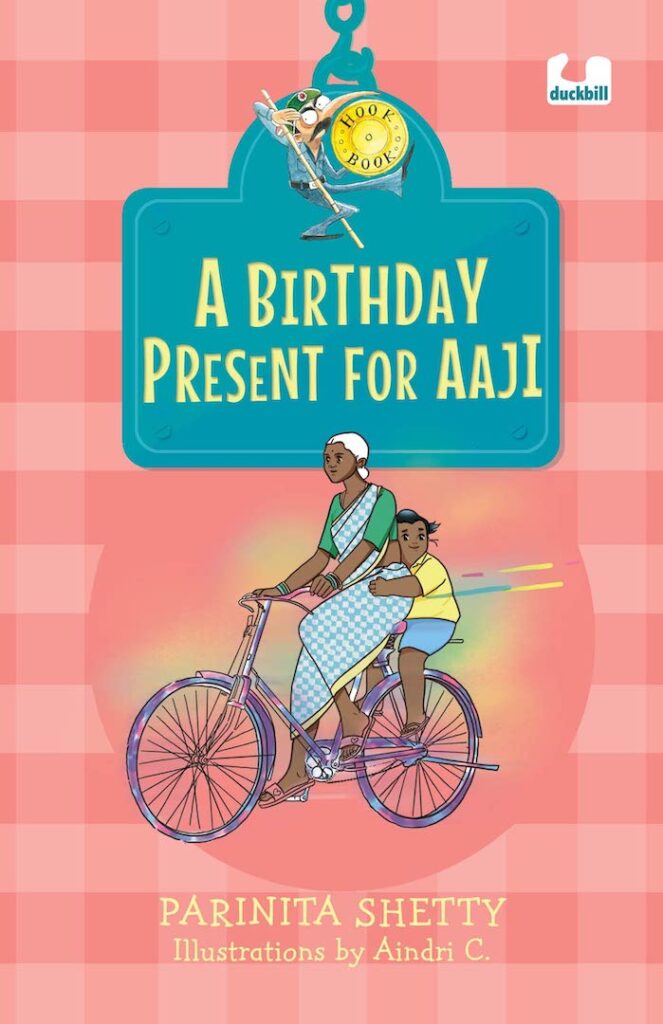 Book Cover
A Birthday Present for Aaji
Parinita Shetty
Illustrations by Aindri C.
Illustration of a white-haired woman on a cycle, with a girl hanging on at the back